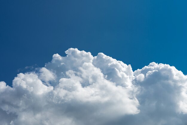 Closeup white cumulus cloud with blue sky for nature background