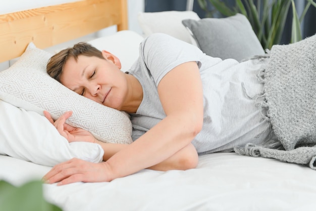 Closeup of woman asleep in bed