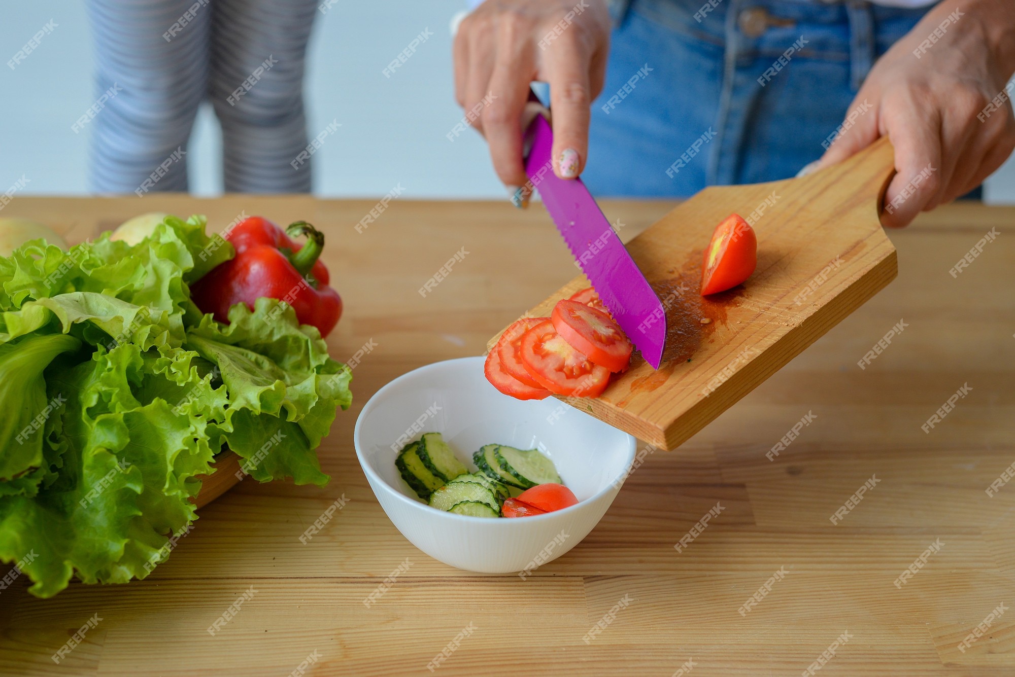 Close-up Of Woman's Hand Chopping Vegetables With Knife In Kitchen Stock  Photo, Picture and Royalty Free Image. Image 56706435.