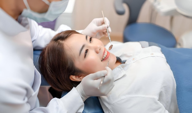 Closeup woman having dental teeth examined dentist checkup via excavator in Clinic her patient for beautiful smile