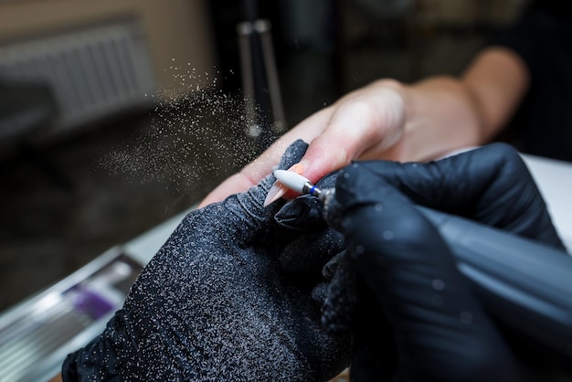 Closeup of a woman in a nail salon getting a manicure