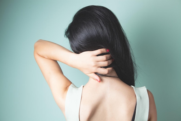 Closeup on a woman's hand massaging her neck Girl's neck hurts