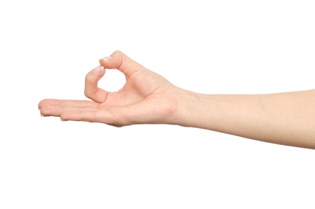 Photo closeup of woman's hand showing ok sign