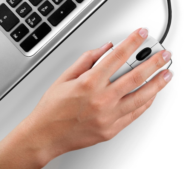 Photo closeup of woman's hand using a mouse