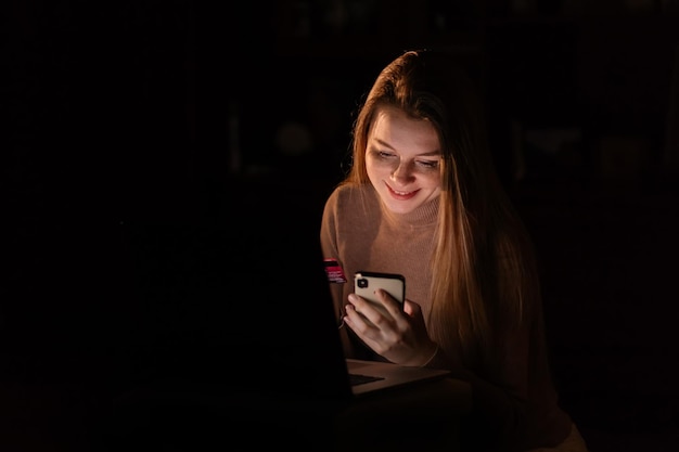 Closeup of woman using credit card and shopping online on her m