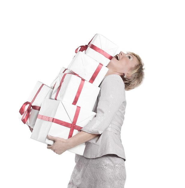 Closeup of woman with lots of gift boxes.isolated on a white wall.