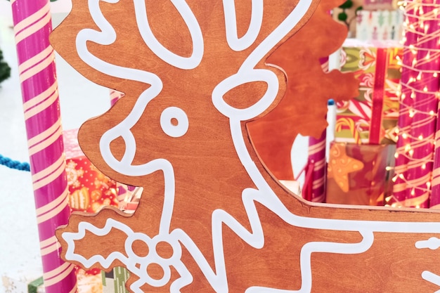 Closeup Wooden deer near boxes with New Year39s gifts Christmas market in the mall