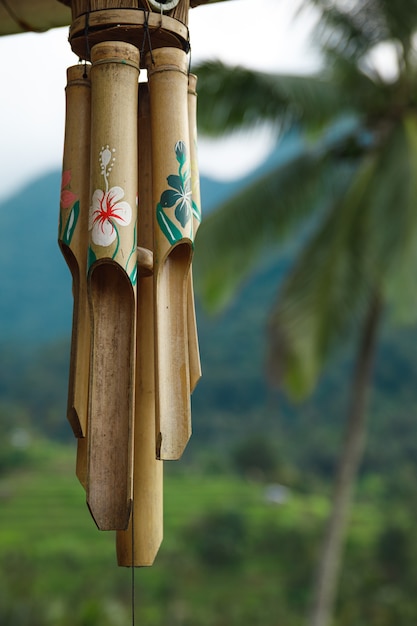 Closeup of wooden wind chime hanging outside