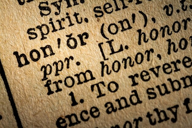 Photo closeup of the word honor and its definition