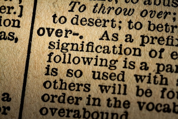 Photo closeup of the word over and its definition