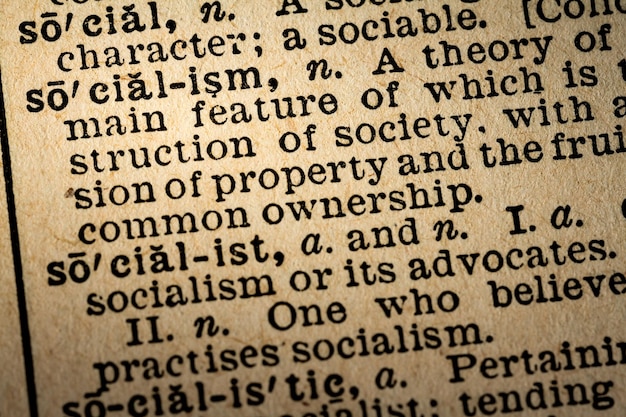 Photo closeup of the word socialism and its definition