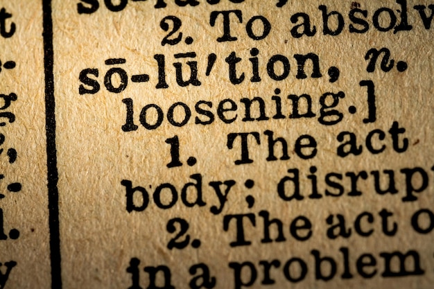 Photo closeup of the word solution and its definition