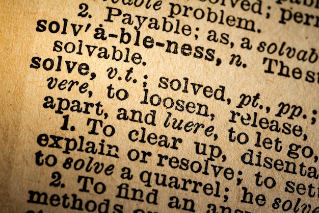 Photo closeup of the word solve and its definition