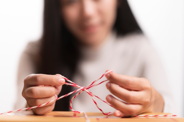 Closeup of a worker hands packing a box