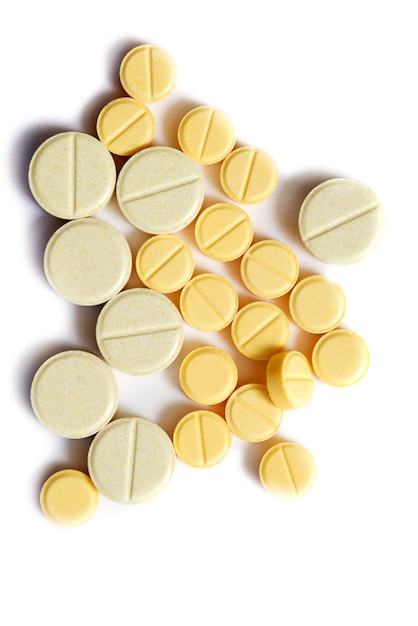 Closeup of yellow tablet on isolated