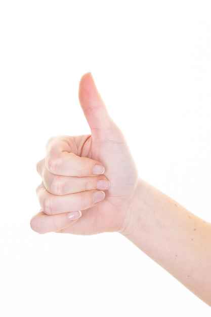 Closeup young woman giving thumb up sign