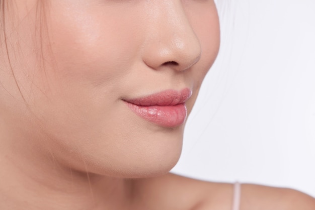 Closeup young woman mouth with clean skin