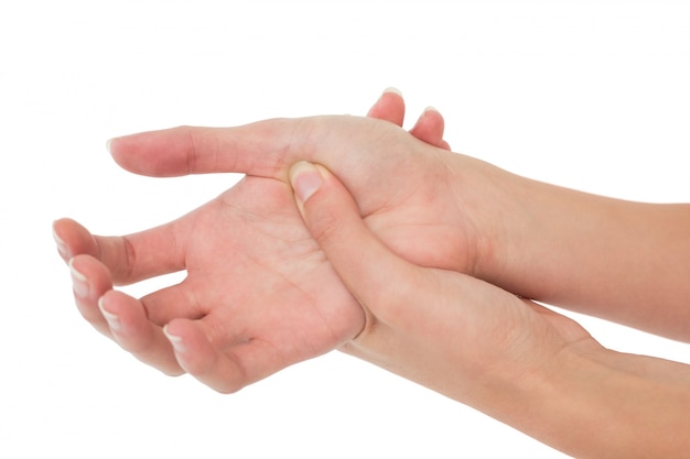 Closeup of a young woman touching her palm