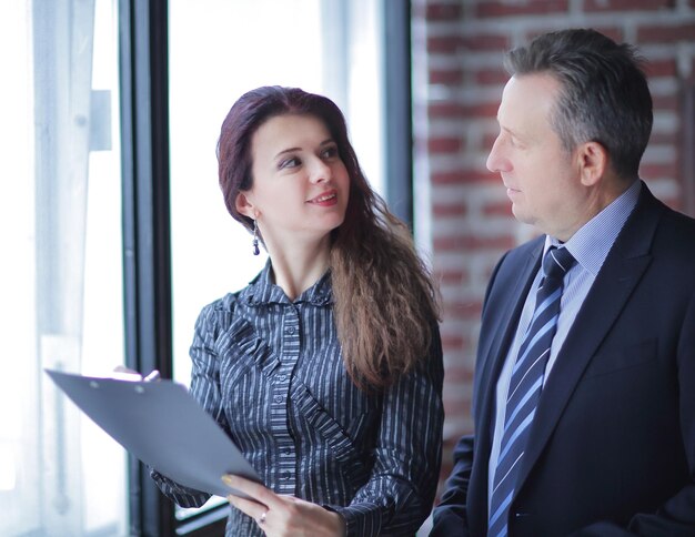 Closeupbusiness woman and investor standing in the office