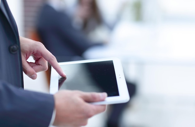 Closeupbusinessman with tablet computer