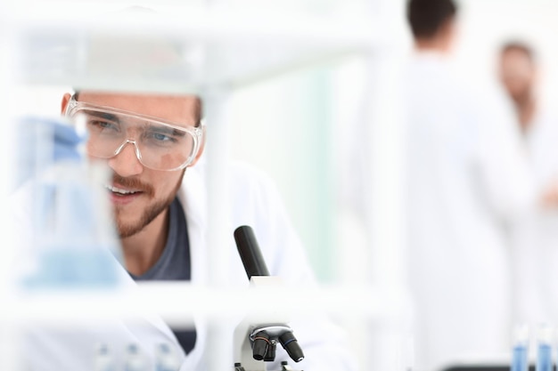 Closeupmale chemist on blurred background laboratory people and science