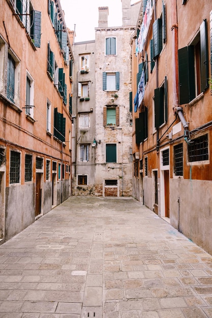 Closeups of building facades in venice italy dead end venetian street fivestory houses with