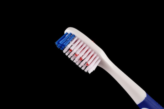 Closuep of toothbrush on dark background