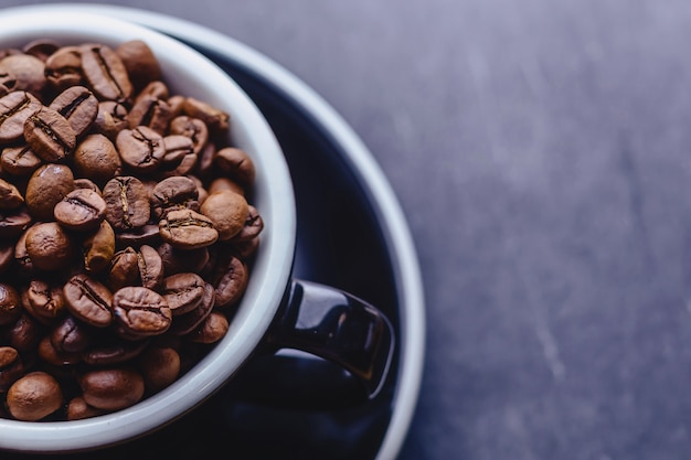 Closup coffee cup full of coffee beans