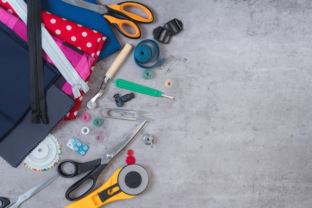 Cloth buttons zipper tape measure tools of a tailor on a table