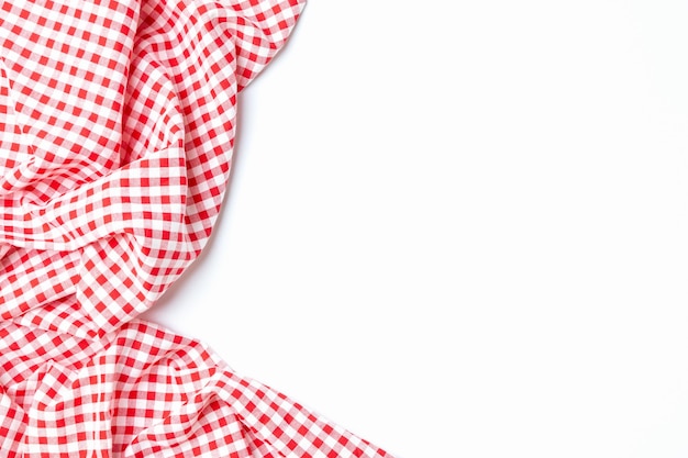 Photo cloth cotton crumpled tablecloth top view fabric red and white checkered isolated on a white background with copy space