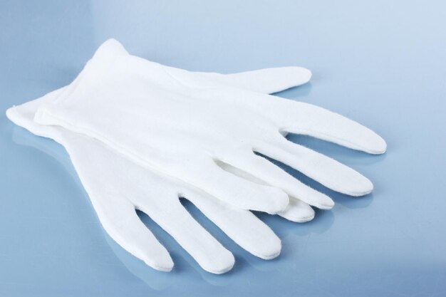 Photo cloth gloves on blue background