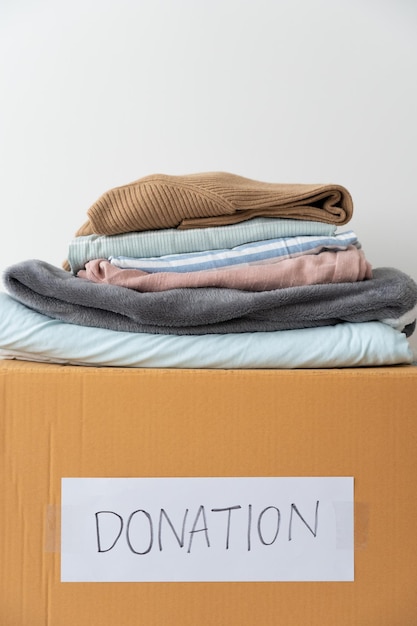 Clothes on the donation box Donation Sharing Volunteer concept