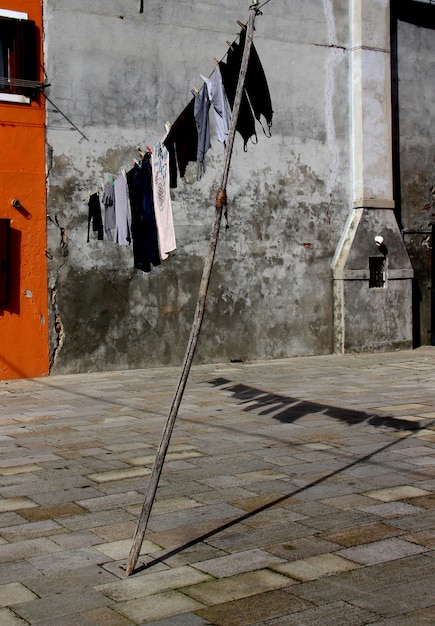 Clothes drying against building