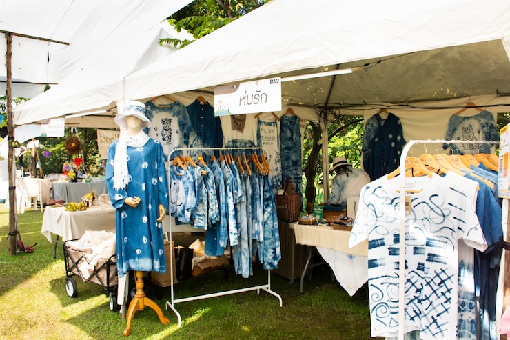 Photo clothes garment fashion with natural colors in handmade shop for thai people traveler travel visit and shopping at local organic market and street bazaar on january 27 2024 in nakhon pathom thailand