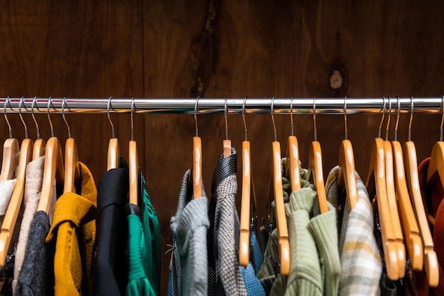 Clothes on hangers in clothing boutique