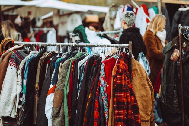 Photo clothes hanging on rack at market