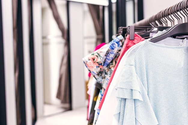 Photo clothes hanging on rack in store