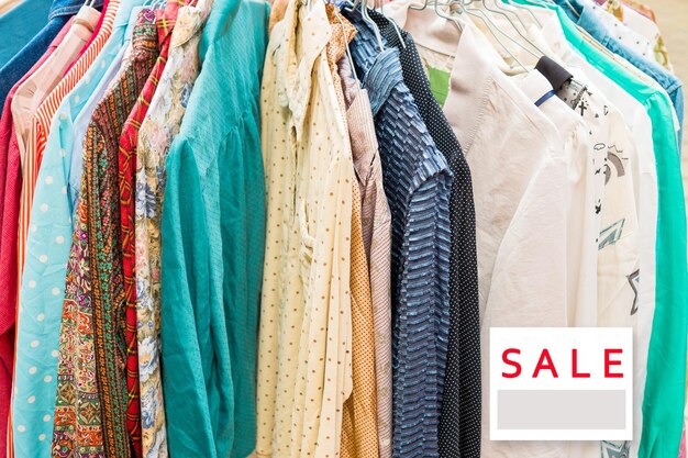 clothes hanging in store for sale in market