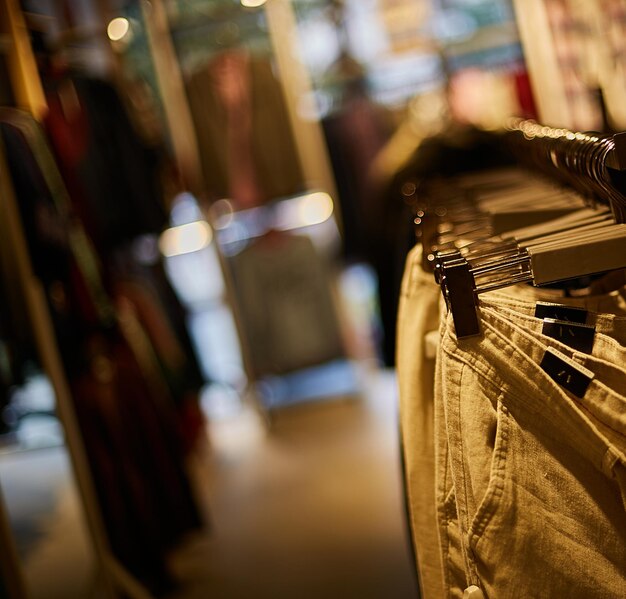 clothes hanging on trempels in the store clothes on trempel in the boutique Sale of clothing