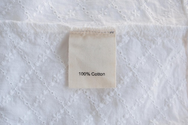 Premium Photo | Clothes label on cotton fabric texture background