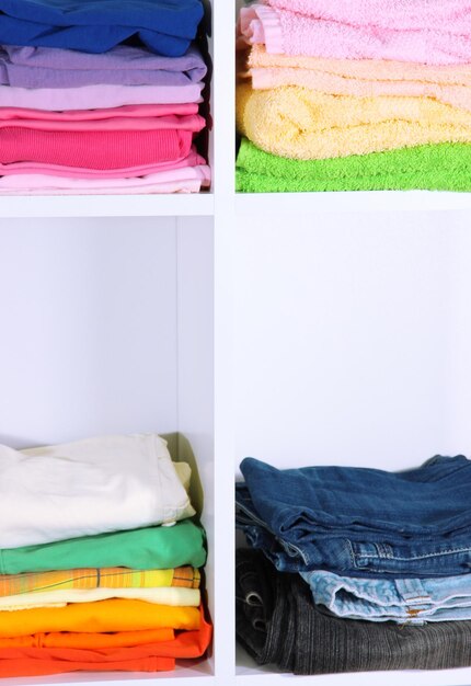 Clothes neatly folded on shelves