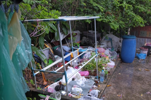 Clothes rack and abandoned objects in back yard