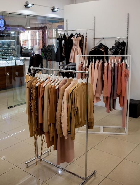 Clothes rack in shopping center women clothes on racks in a\
boutique store