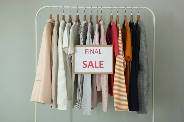 Clothes on the rail and a sale sign final sale discounts