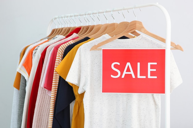 clothes on the rail and a sale sign final sale discounts