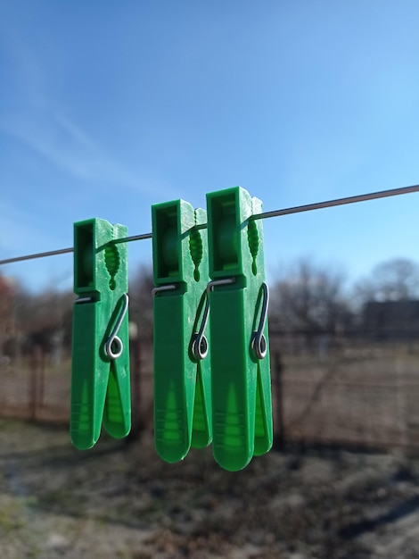 Photo clothespins on a background of blue sky