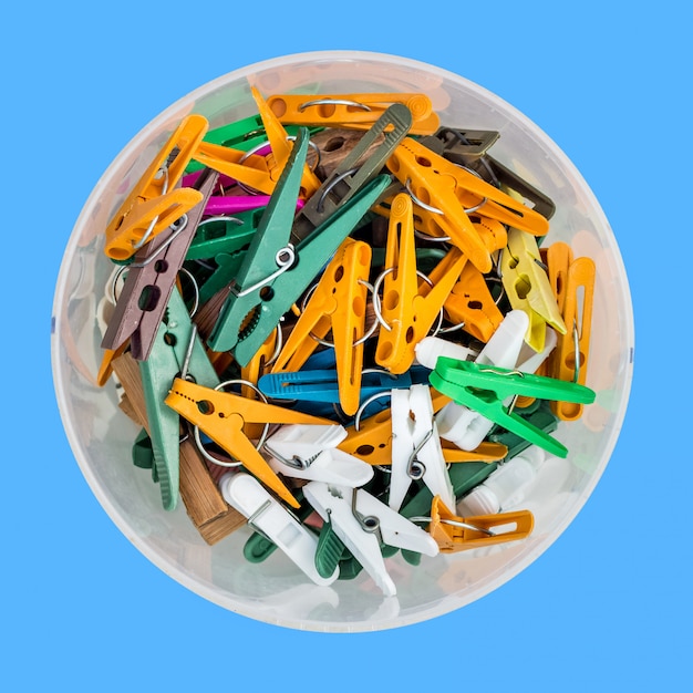 Clothespins for clothes in a plastic bucket