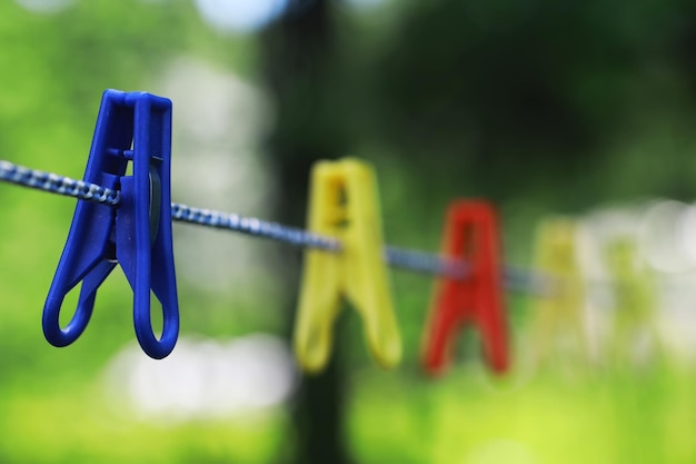 Clothespins on a clothesline in summer Dry clothes outside Clothes on a rope