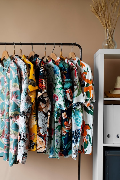 Clothing rack with floral hawaiian shirts on hangers