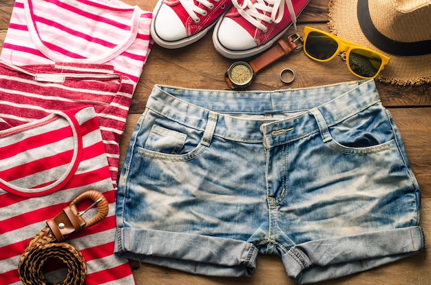 clothing for women, placed on a wooden floor.